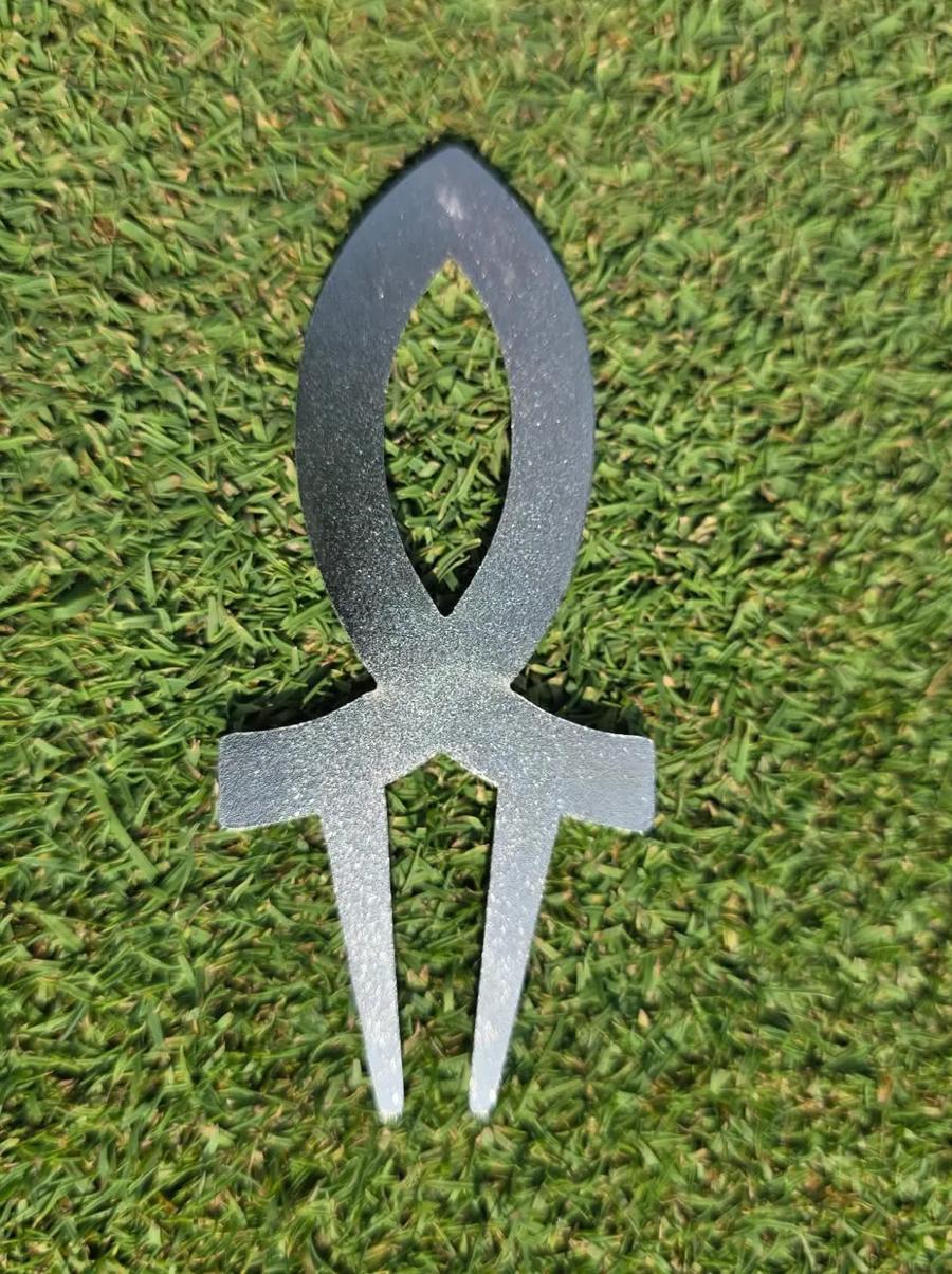 Back of the Aim for Perfection divot tool showing its fork construction